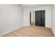 Empty bedroom with wood-look floors and closet at 5541 Downs Way, Lithonia, GA 30058