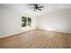 Bright bedroom with hardwood floors and large window at 5541 Downs Way, Lithonia, GA 30058