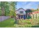 House backyard with screened porch and landscaping at 1393 Lanier Ne Pl, Atlanta, GA 30306