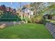 Landscaped backyard with retaining walls at 1393 Lanier Pl, Atlanta, GA 30306