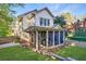 House backyard with screened porch and landscaping at 1393 Lanier Ne Pl, Atlanta, GA 30306