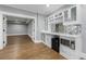 Modern basement bar with white cabinets and mirrored backsplash at 1393 Lanier Ne Pl, Atlanta, GA 30306