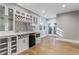 Basement wet bar with wine storage, microwave, and granite countertop at 1393 Lanier Ne Pl, Atlanta, GA 30306