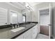 Modern bathroom with double vanity and dark countertop at 1393 Lanier Pl, Atlanta, GA 30306