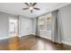 Spacious bedroom with hardwood floors, ceiling fan and en-suite bathroom at 1393 Lanier Pl, Atlanta, GA 30306