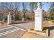 Entrance to Senoia Park with brick pillars and wrought iron fence at 1393 Lanier Pl, Atlanta, GA 30306