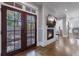 Bright entryway with hardwood floors and french doors leading to backyard at 1393 Lanier Pl, Atlanta, GA 30306