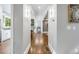 Long hallway with hardwood floors and views into kitchen and living areas at 1393 Lanier Ne Pl, Atlanta, GA 30306