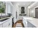 Modern kitchen with white and gray cabinets and a large island at 1393 Lanier Pl, Atlanta, GA 30306