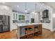 Spacious kitchen with white cabinets, center island, and stainless steel appliances at 1393 Lanier Pl, Atlanta, GA 30306