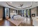 Luxurious main bedroom with fireplace, hardwood floors, and large windows at 1393 Lanier Pl, Atlanta, GA 30306