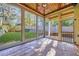 Spacious screened porch with wood ceiling and view of yard at 1393 Lanier Ne Pl, Atlanta, GA 30306