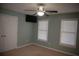 Bedroom with ceiling fan, neutral walls, and double closets at 2815 Shoemaker Ln, Snellville, GA 30039