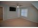 Bedroom with ceiling fan, neutral walls, and window at 2815 Shoemaker Ln, Snellville, GA 30039