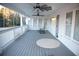 Large deck with ceiling fans, white railings, and a view of the backyard at 2815 Shoemaker Ln, Snellville, GA 30039