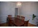 Formal dining room with wood table and chandelier at 2815 Shoemaker Ln, Snellville, GA 30039