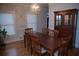 Dining room with wood table, buffet, and chandelier at 2815 Shoemaker Ln, Snellville, GA 30039