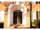 Elegant arched double door with ornate iron detailing at 2815 Shoemaker Ln, Snellville, GA 30039