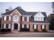 Two-story brick home with a gray roof, white accents, and black shutters at 2815 Shoemaker Ln, Snellville, GA 30039