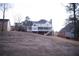 Two-story house with white siding, large deck, and stairs leading to the backyard at 2815 Shoemaker Ln, Snellville, GA 30039