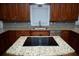 Kitchen featuring granite countertops, stainless steel appliances, and wooden cabinets at 2815 Shoemaker Ln, Snellville, GA 30039