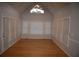 Bright sunroom with hardwood floors, multiple windows, and a vaulted ceiling at 2815 Shoemaker Ln, Snellville, GA 30039