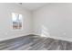 Spacious bedroom with large window and grey vinyl flooring at 30 Sportsman Path, Dallas, GA 30157