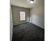 Bright bedroom featuring carpet flooring and a window at 30 Sportsman Path, Dallas, GA 30157