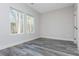 Bright bedroom with two windows and grey vinyl flooring at 30 Sportsman Path, Dallas, GA 30157