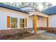 Front porch with wooden pillars and stone accents at 30 Sportsman Path, Dallas, GA 30157