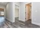 Hallway with vinyl flooring and doors to bedrooms and bathroom at 30 Sportsman Path, Dallas, GA 30157