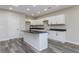 Modern kitchen with white cabinets and an island at 30 Sportsman Path, Dallas, GA 30157