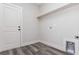 Laundry room with built-in shelving and vinyl flooring at 30 Sportsman Path, Dallas, GA 30157