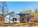 Back of house with covered patio and wooden posts at 30 Sportsman Path, Dallas, GA 30157