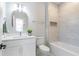 Bathroom with white vanity, bathtub, and marble tile at 3463 Victoria St, Atlanta, GA 30337