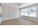 Bright bedroom with hardwood floors, large windows, and a barn door at 3463 Victoria St, Atlanta, GA 30337