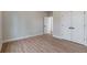 Spacious bedroom with wood-look floors and double doors at 3463 Victoria St, Atlanta, GA 30337