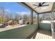 Private deck with wood flooring, ceiling fan, and view of neighborhood at 3463 Victoria St, Atlanta, GA 30337