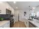 Modern kitchen with white cabinets, quartz countertops and stainless steel appliances at 3463 Victoria St, Atlanta, GA 30337