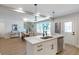 Modern kitchen island with seating, open to dining and living areas at 3463 Victoria St, Atlanta, GA 30337