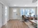 Bright living room with hardwood floors, white door, and two armchairs at 3463 Victoria St, Atlanta, GA 30337