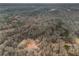 Aerial view showcasing the house and surrounding wooded acreage at 1275 Poole Bridge Rd, Hiram, GA 30141
