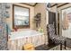 Bathroom with a jetted tub and brick wall at 1275 Poole Bridge Rd, Hiram, GA 30141