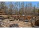 Wooden deck overlooking a wooded backyard with playground at 1275 Poole Bridge Rd, Hiram, GA 30141