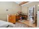 View of cluttered room with furniture, boxes, rug, and doorway to exterior at 1275 Poole Bridge Rd, Hiram, GA 30141