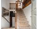 Entrance staircase with carpeted steps and wooden railing at 1275 Poole Bridge Rd, Hiram, GA 30141