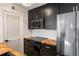 Contemporary kitchen with dark cabinets, herringbone countertops and stainless steel appliances at 404 Granville Ct, Atlanta, GA 30328