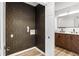 Laundry room with geometric patterned wallpaper and built-in shelving at 404 Granville Ct, Atlanta, GA 30328