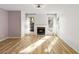 Bright living room featuring a fireplace and updated flooring at 404 Granville Ct, Atlanta, GA 30328