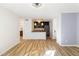 Bright living room with hardwood floors and view into updated kitchen at 404 Granville Ct, Atlanta, GA 30328